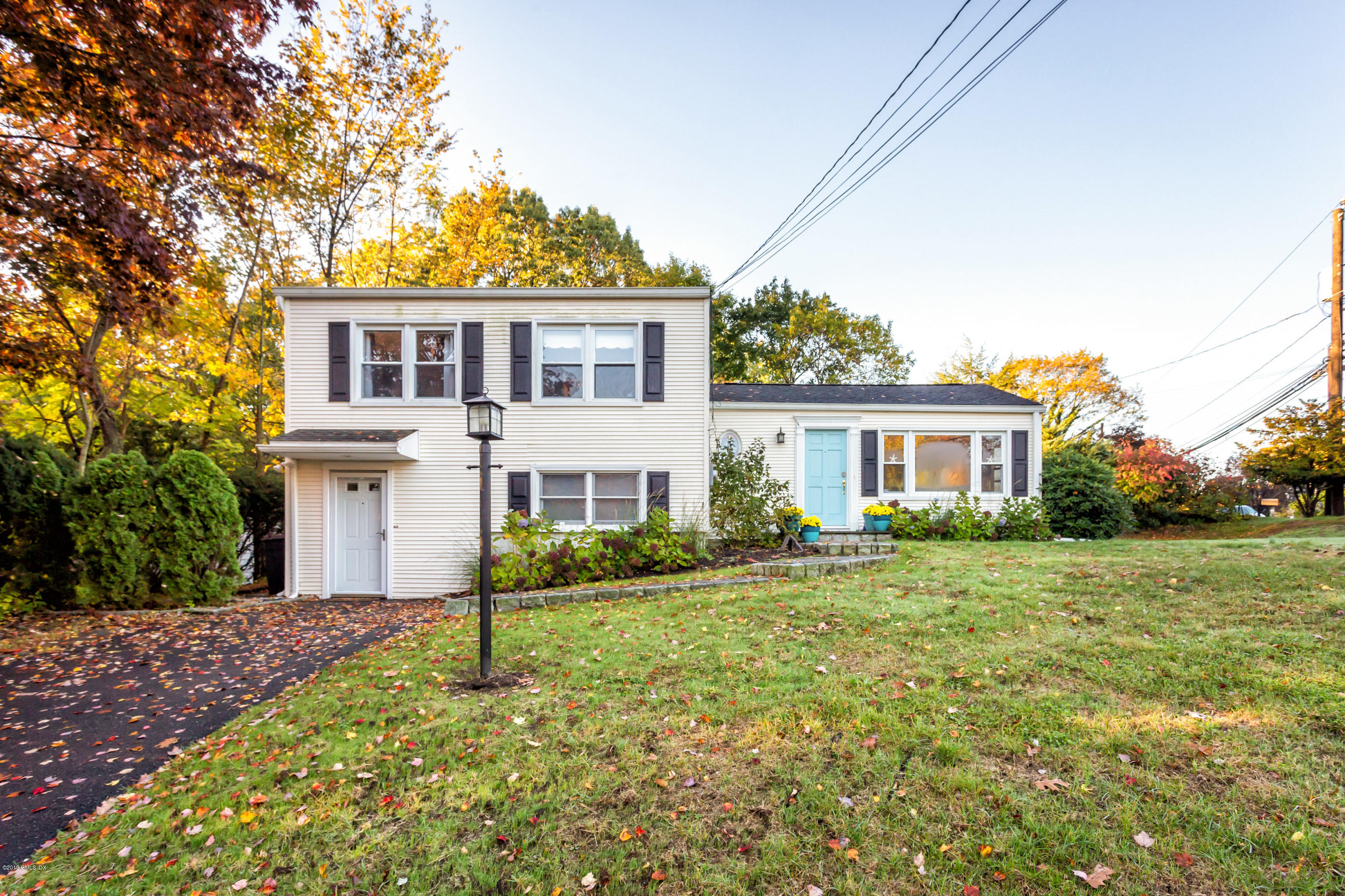 12 Mary Lane Riverside, CT 06878 - Photo 3 of 25 a front view of a house with a yard