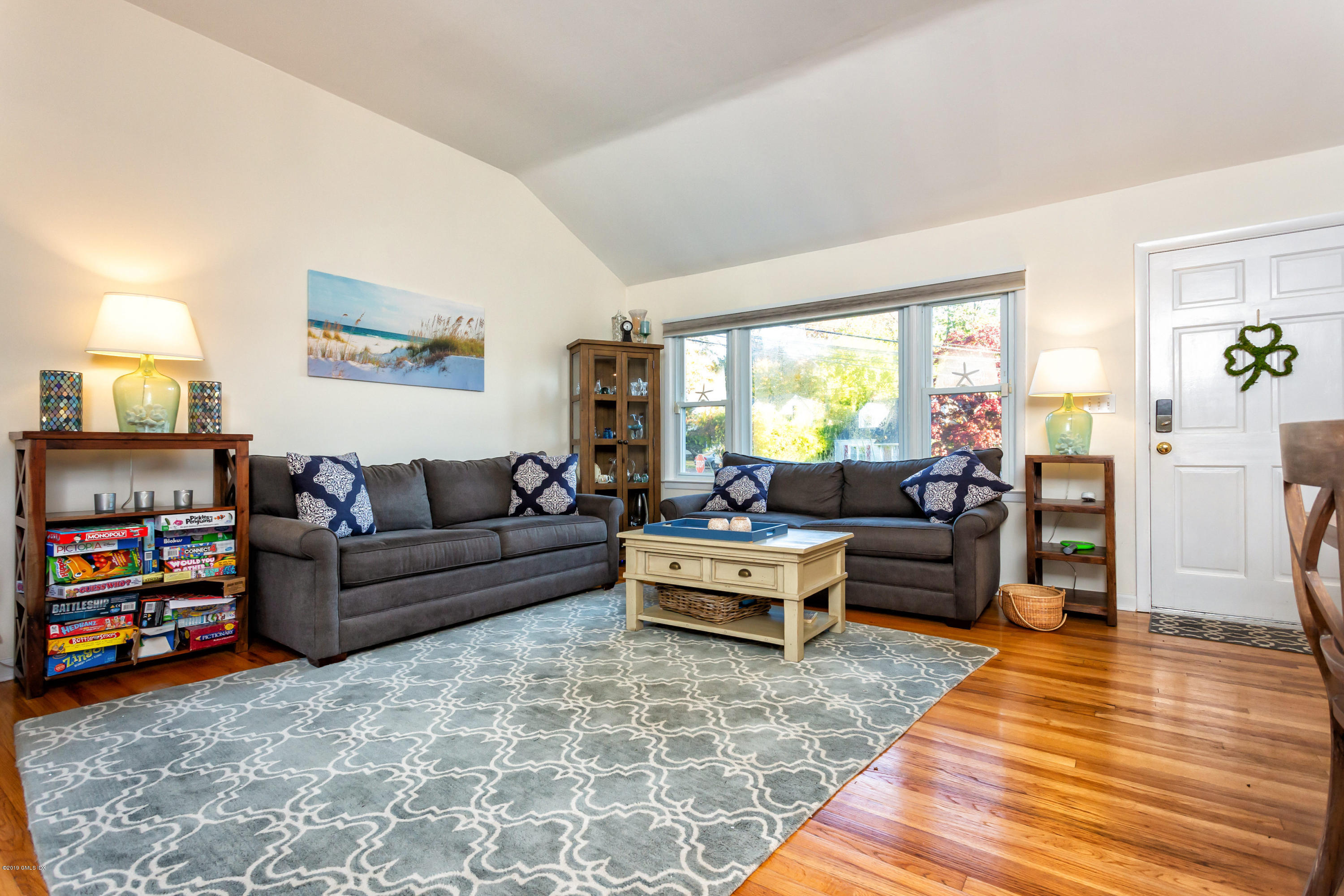 12 Mary Lane Riverside, CT 06878 - Photo 7 of 25 a living room with furniture and a large window