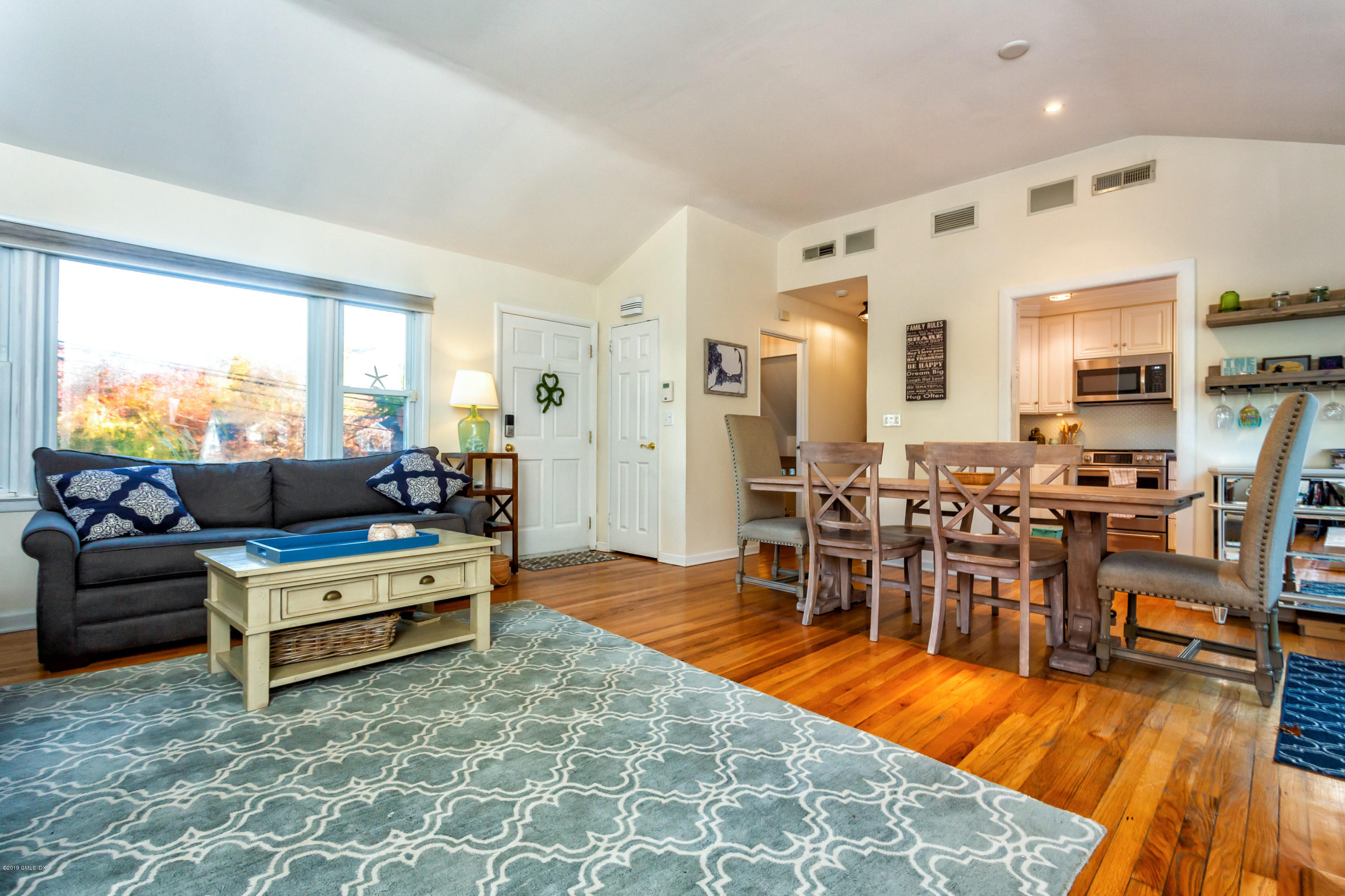 12 Mary Lane Riverside, CT 06878 - Photo 8 of 25 a living room with lots of furniture and kitchen view