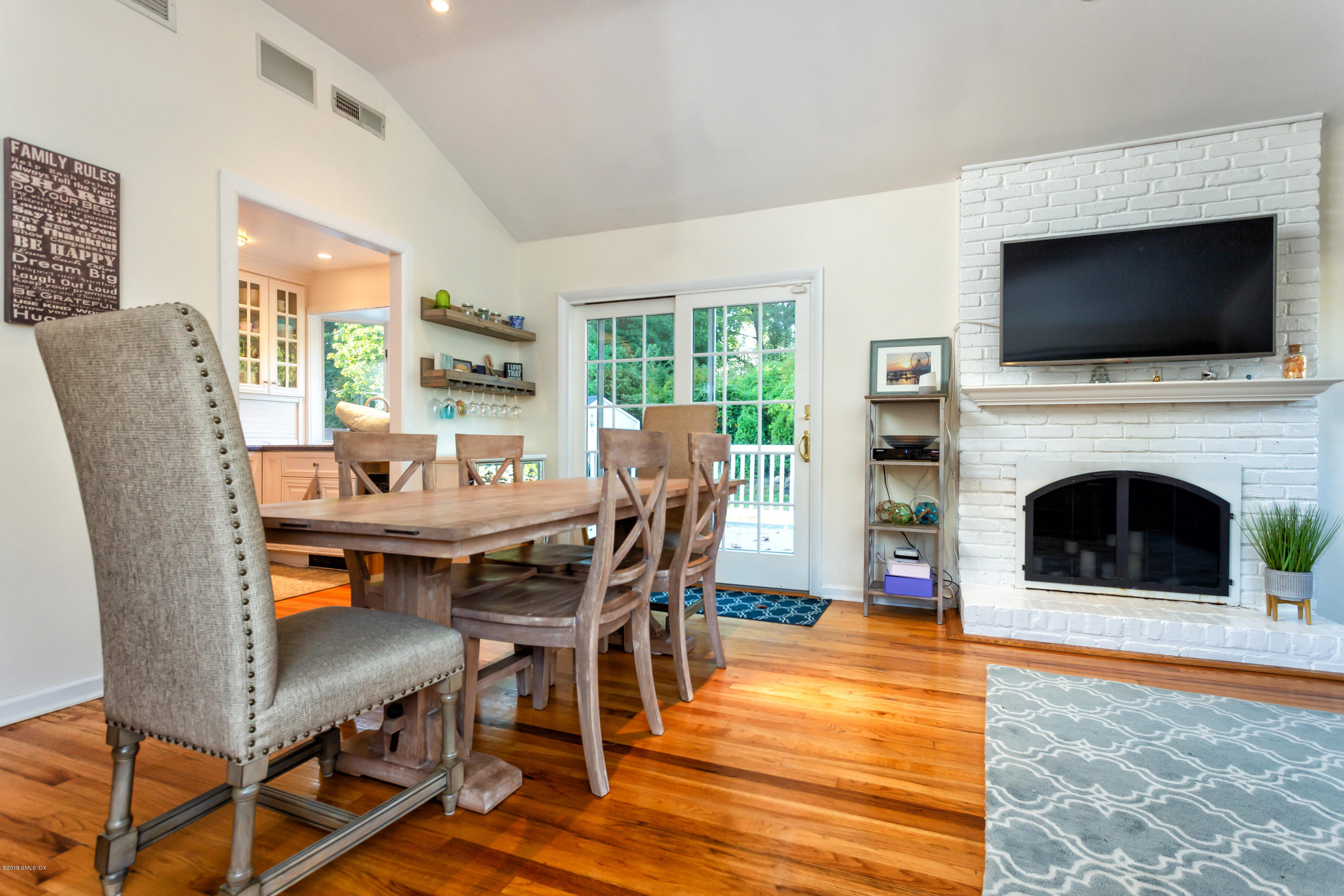 12 Mary Lane Riverside, CT 06878 - Photo 10 of 25 a view of a dining room with furniture window and wooden floor