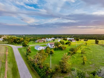 a view of a house with a big yard