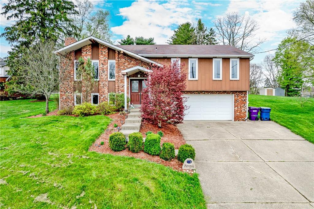 321 Eighmy Road Pittsburgh, PA 15239 - Photo 1 of 24 a front view of a house with garden