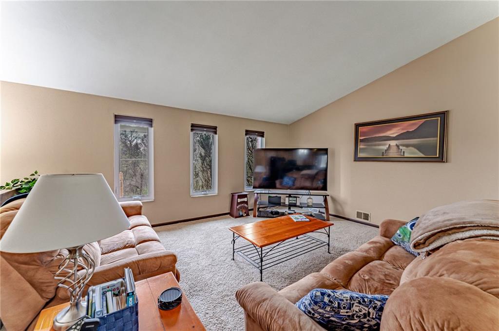 321 Eighmy Road Pittsburgh, PA 15239 - Photo 11 of 24 a living room with furniture and a flat screen tv