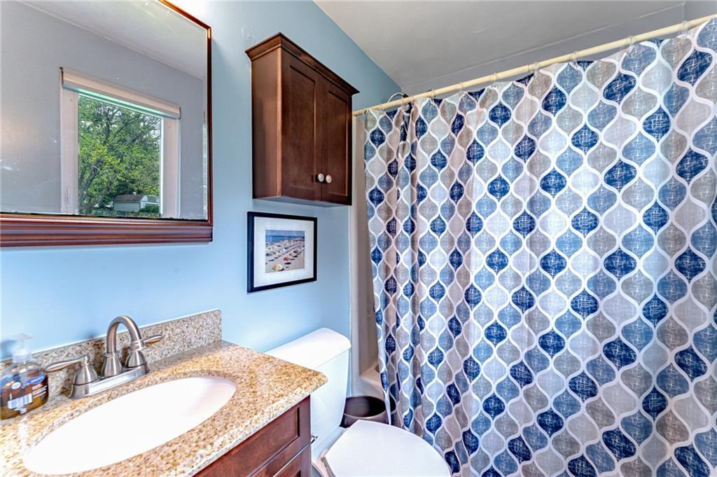321 Eighmy Road Pittsburgh, PA 15239 - Photo 17 of 24 a bathroom with a granite countertop sink and a mirror