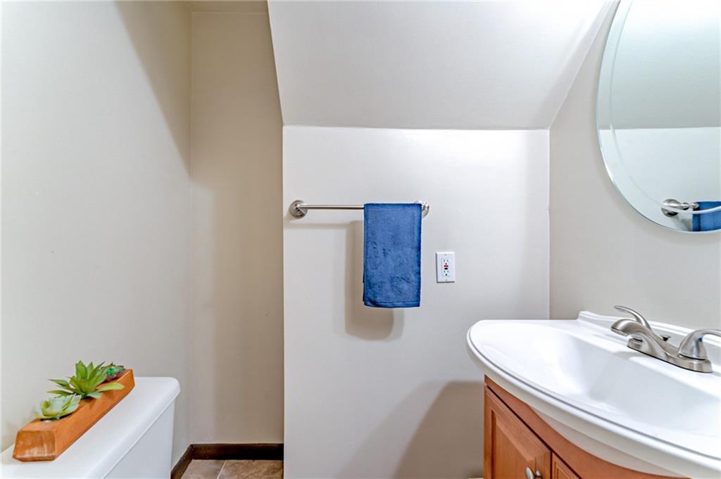 321 Eighmy Road Pittsburgh, PA 15239 - Photo 22 of 24 a bathroom with a sink and a mirror