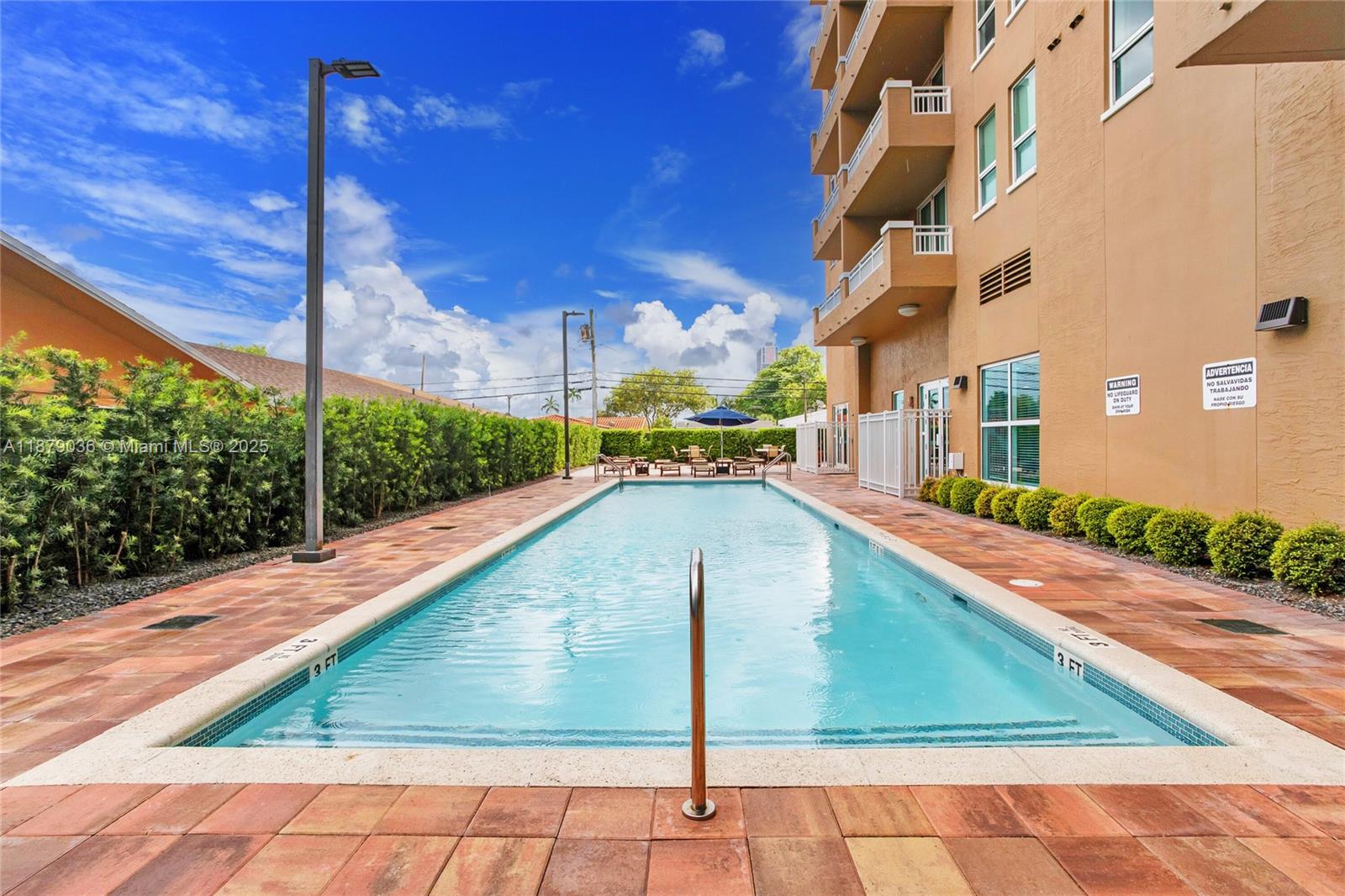 2665 Southwest 37th Avenue, Unit 512 Miami, FL 33133 - Photo 11 of 17 a view of a swimming pool