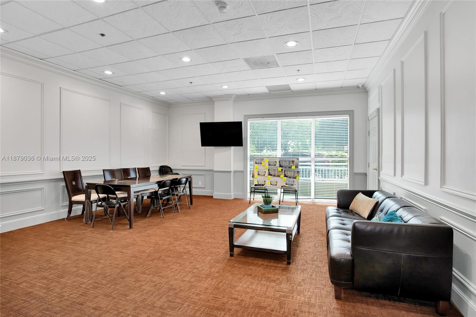 2665 Southwest 37th Avenue, Unit 512 Miami, FL 33133 - Photo 14 of 17 a living room with furniture and a flat screen tv