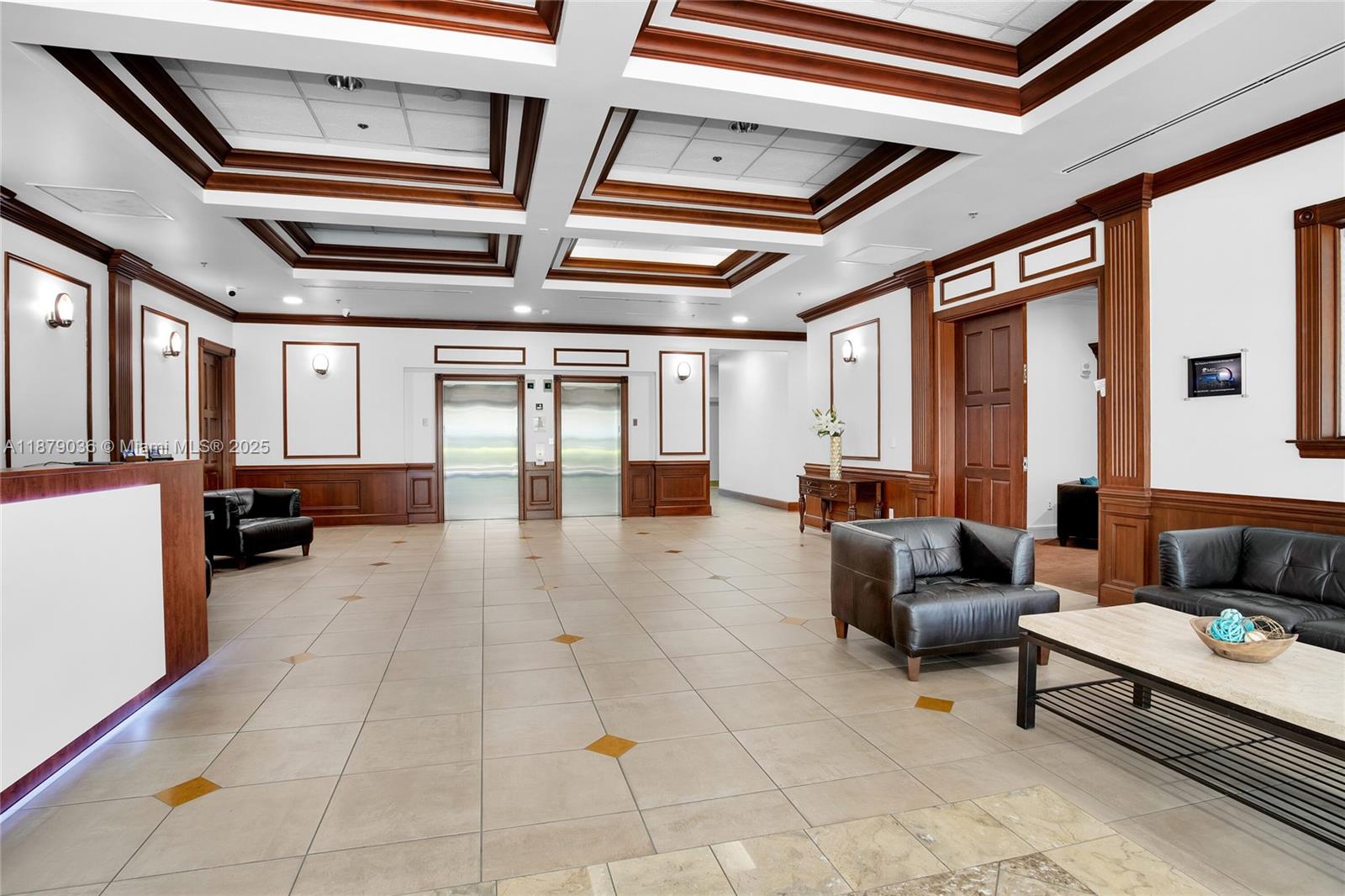 2665 Southwest 37th Avenue, Unit 512 Miami, FL 33133 - Photo 15 of 17 a living room with furniture and a dining table