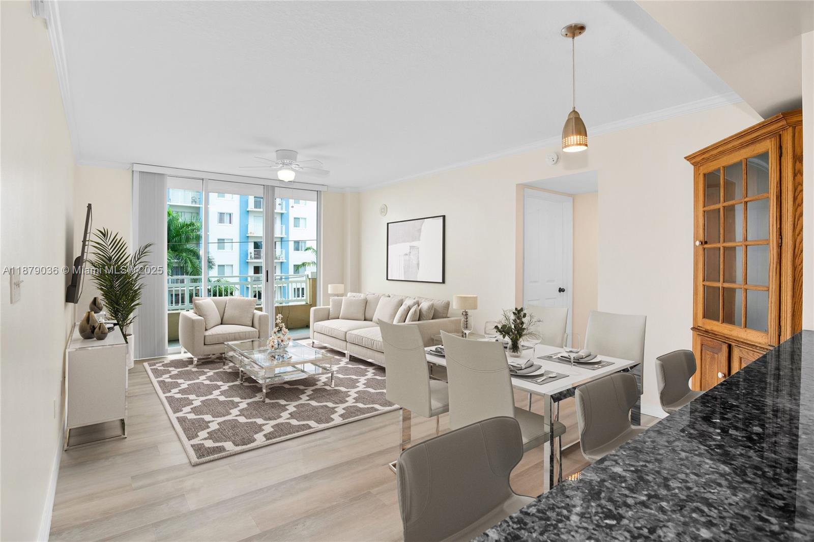 2665 Southwest 37th Avenue, Unit 512 Miami, FL 33133 - Photo 2 of 17 a living room with furniture large window and wooden floor