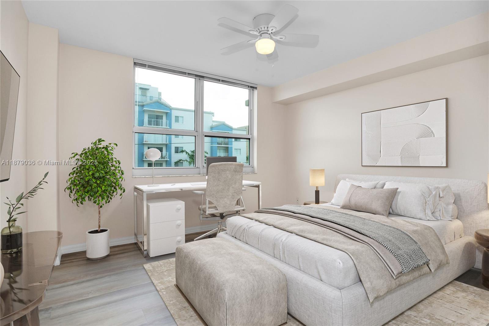 2665 Southwest 37th Avenue, Unit 512 Miami, FL 33133 - Photo 4 of 17 a bedroom with a large bed and a potted plant