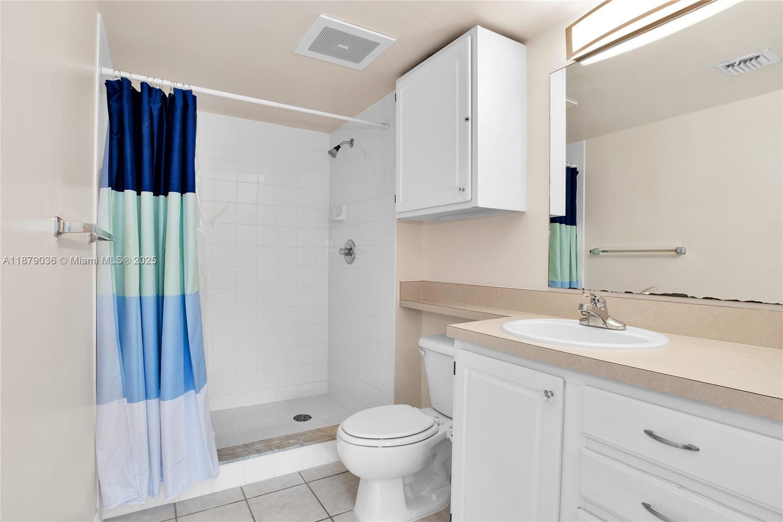 2665 Southwest 37th Avenue, Unit 512 Miami, FL 33133 - Photo 5 of 17 a bathroom with a sink toilet and shower