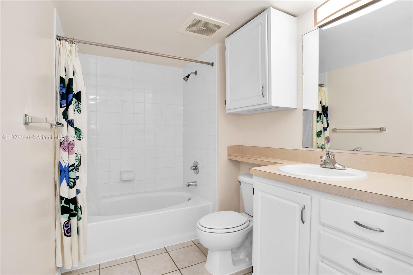 2665 Southwest 37th Avenue, Unit 512 Miami, FL 33133 - Photo 7 of 17 a bathroom with a sink a toilet and a bathtub