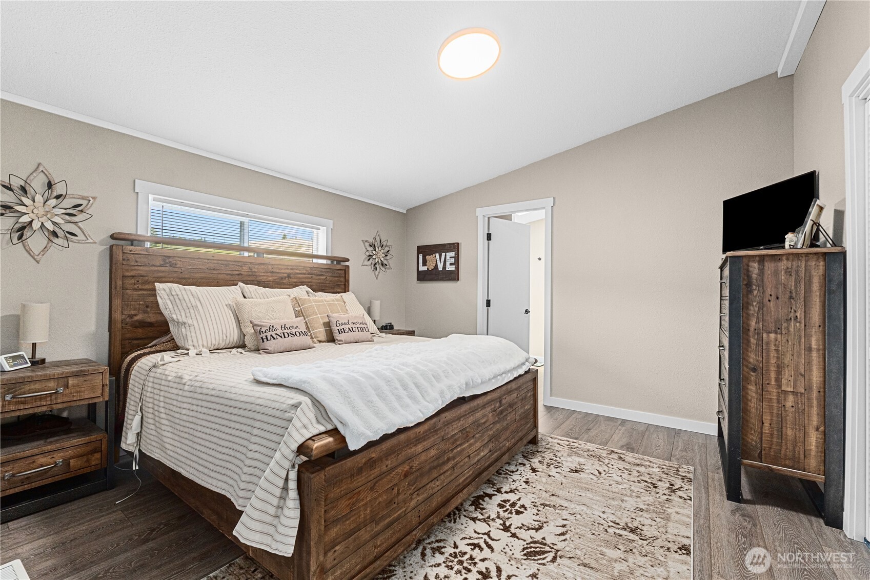 4562 Lessig Road, Unit A Hunters, WA 99137 - Photo 11 of 34 a bedroom with bed and flat screen tv