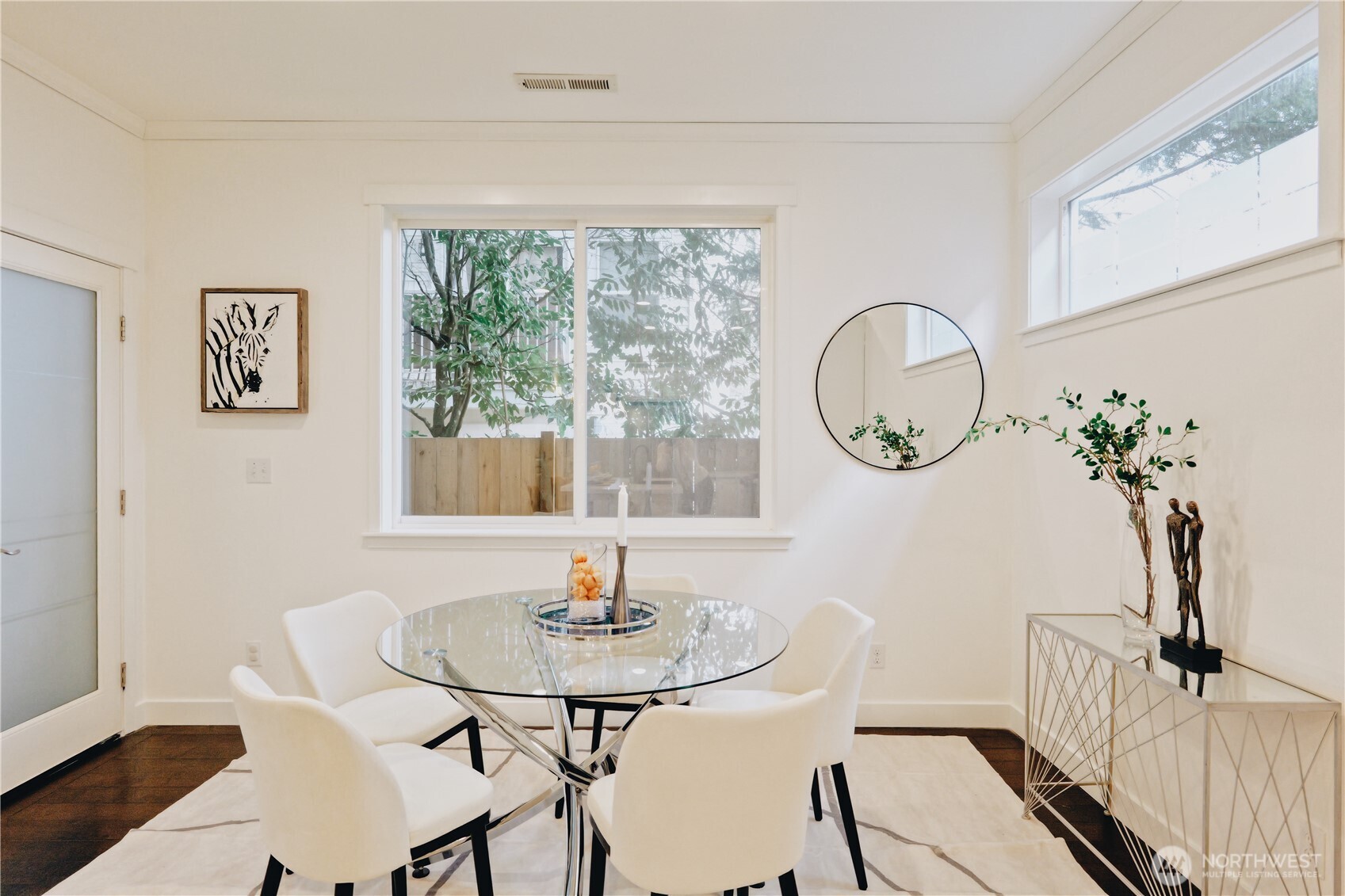 12008 Northeast 162nd Place Bothell, WA 98011 - Photo 11 of 35 a view of a dining room with furniture window and wooden floor