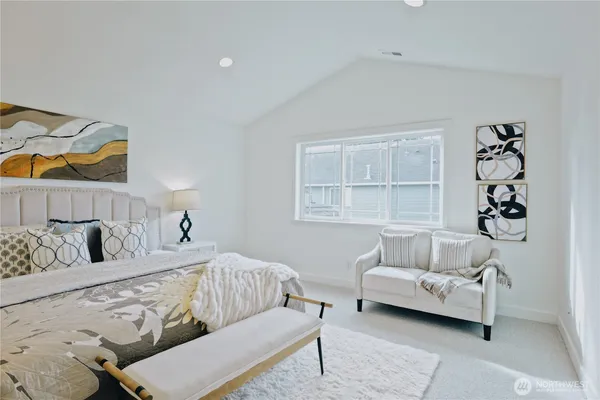 a bedroom with furniture and a window
