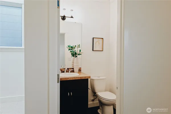 a bathroom with a toilet and a sink