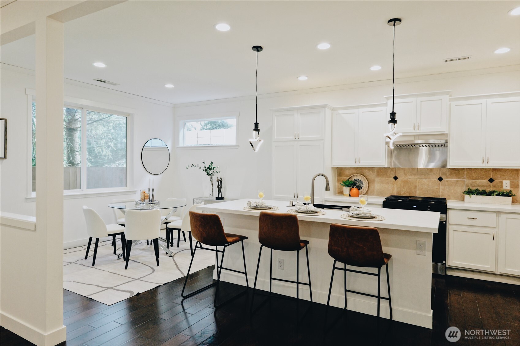 12008 Northeast 162nd Place Bothell, WA 98011 - Photo 5 of 35 a view of kitchen with dining table chairs sink and stove