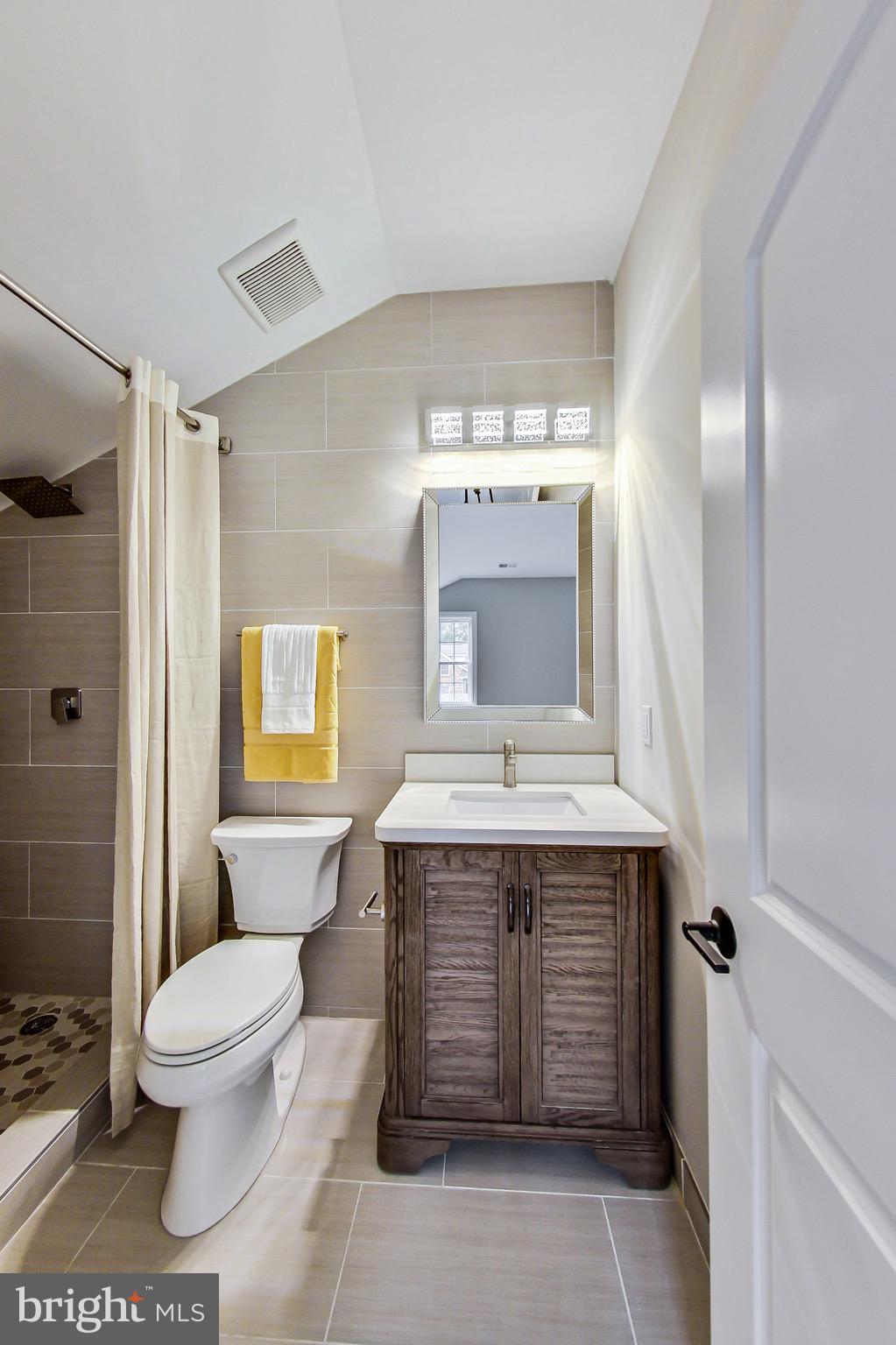 3104 Sleepy Hollow Road Falls Church, VA 22042 - Photo 16 of 89 a bathroom with a sink toilet and shower
