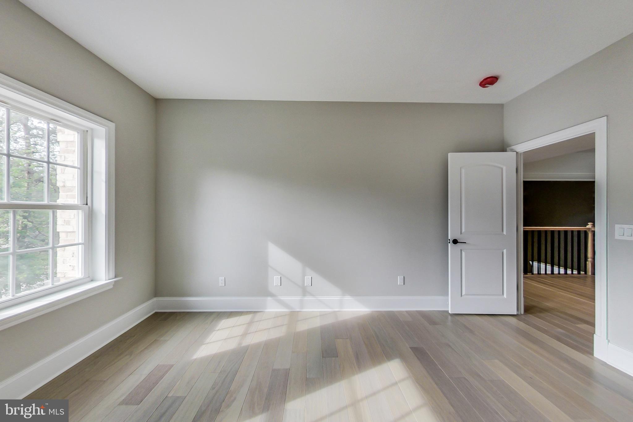 3104 Sleepy Hollow Road Falls Church, VA 22042 - Photo 32 of 89 an empty room with wooden floor and windows