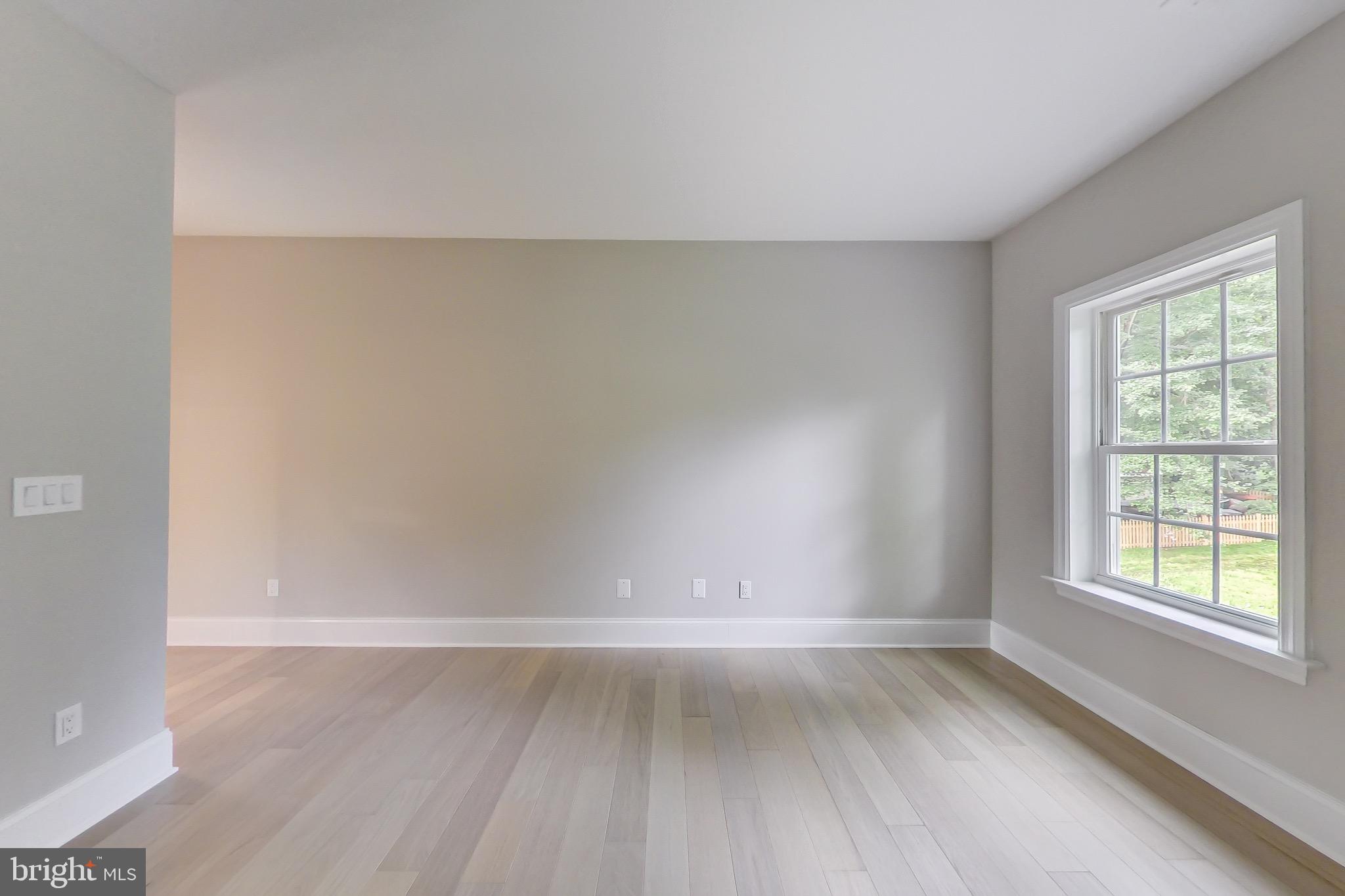 3104 Sleepy Hollow Road Falls Church, VA 22042 - Photo 33 of 89 a view of an empty room with wooden floor and a window
