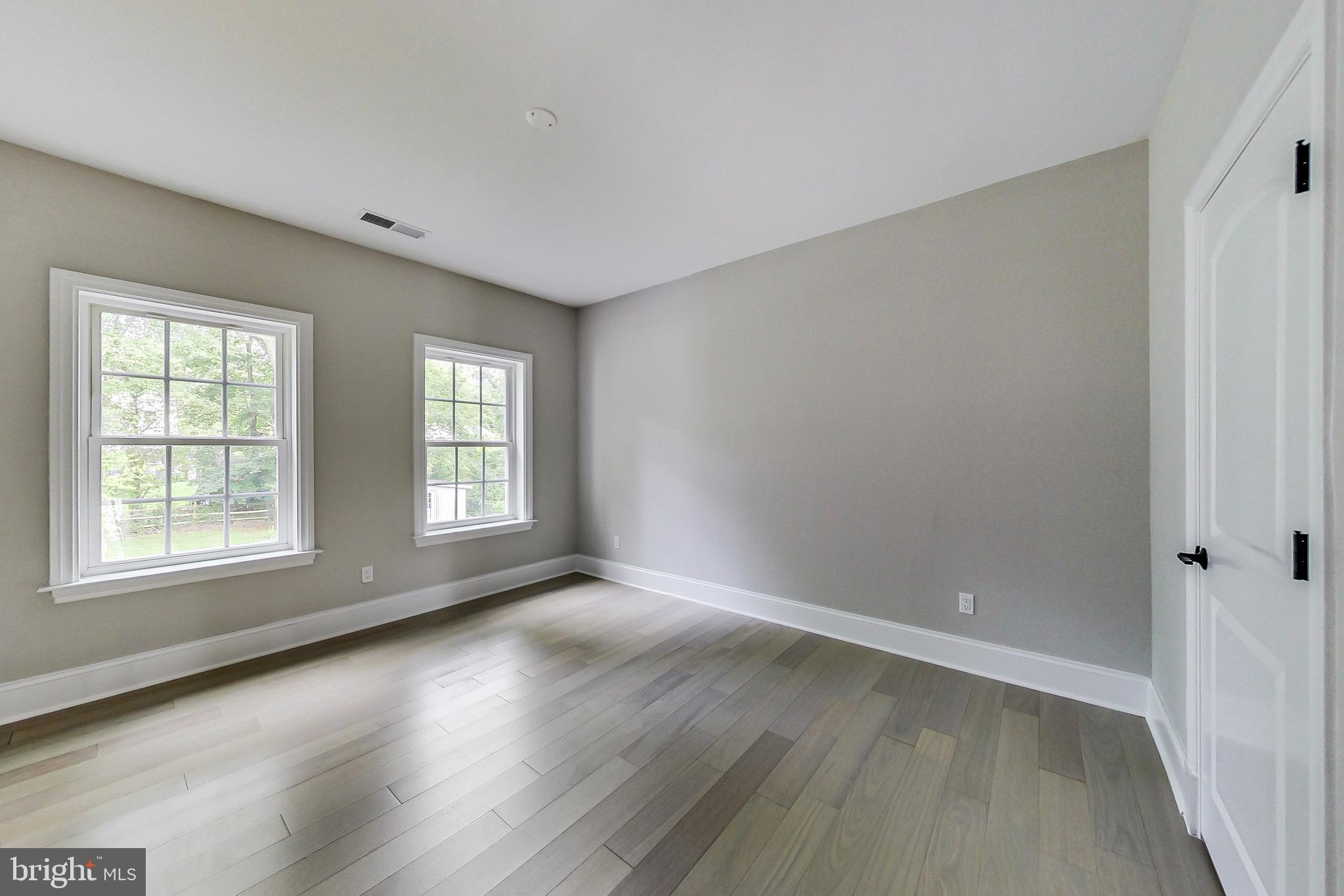 3104 Sleepy Hollow Road Falls Church, VA 22042 - Photo 36 of 89 an empty room with wooden floor and windows