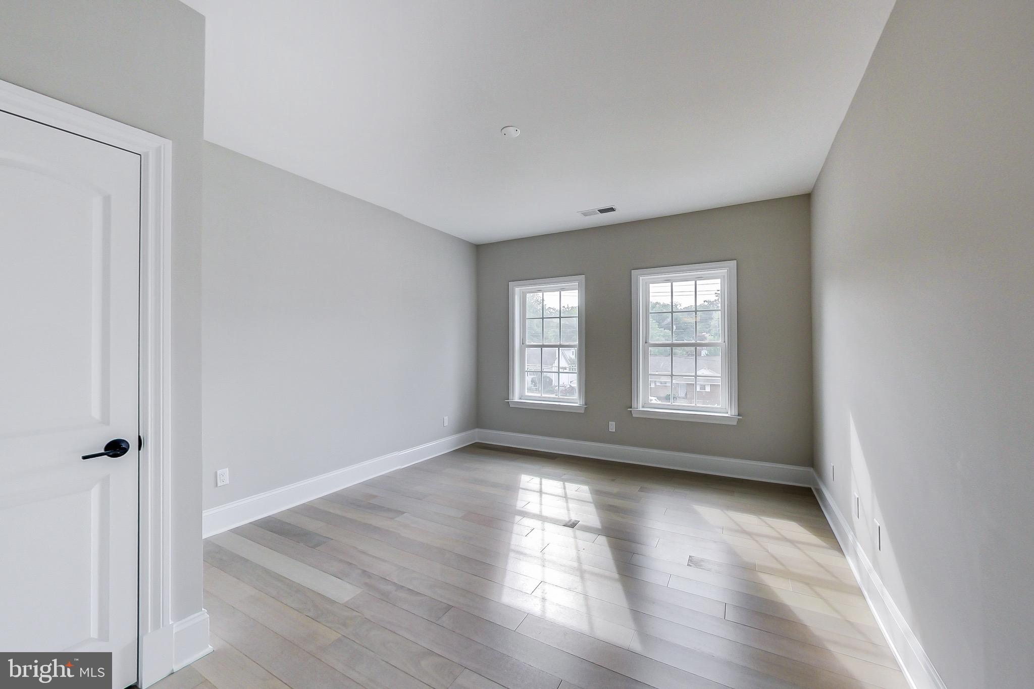 3104 Sleepy Hollow Road Falls Church, VA 22042 - Photo 40 of 89 a view of empty room with wooden floor and fan