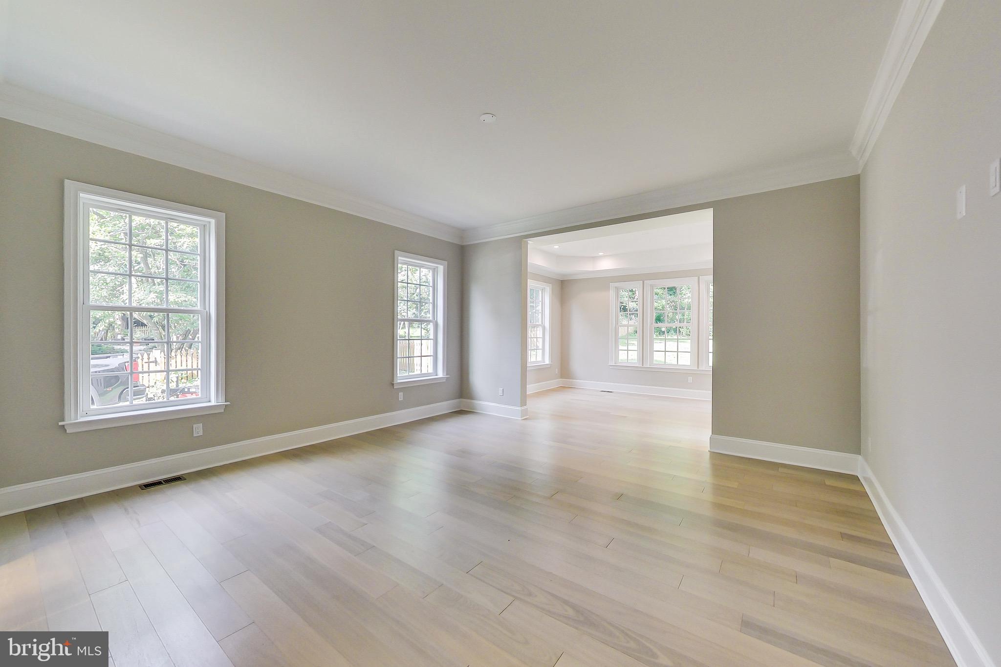 3104 Sleepy Hollow Road Falls Church, VA 22042 - Photo 42 of 89 a view of an empty room with wooden floor and a window