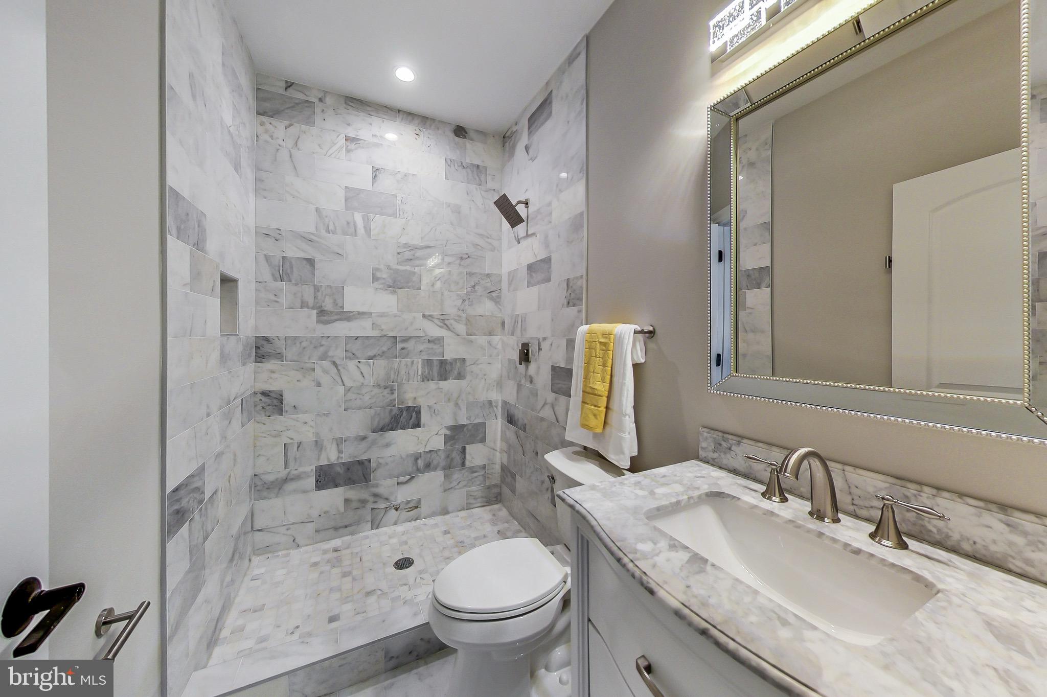3104 Sleepy Hollow Road Falls Church, VA 22042 - Photo 46 of 89 a bathroom with a granite countertop sink toilet and shower