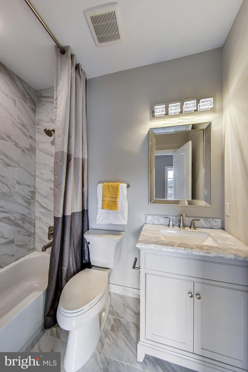 3104 Sleepy Hollow Road Falls Church, VA 22042 - Photo 47 of 89 a bathroom with a sink a toilet and a bathtub
