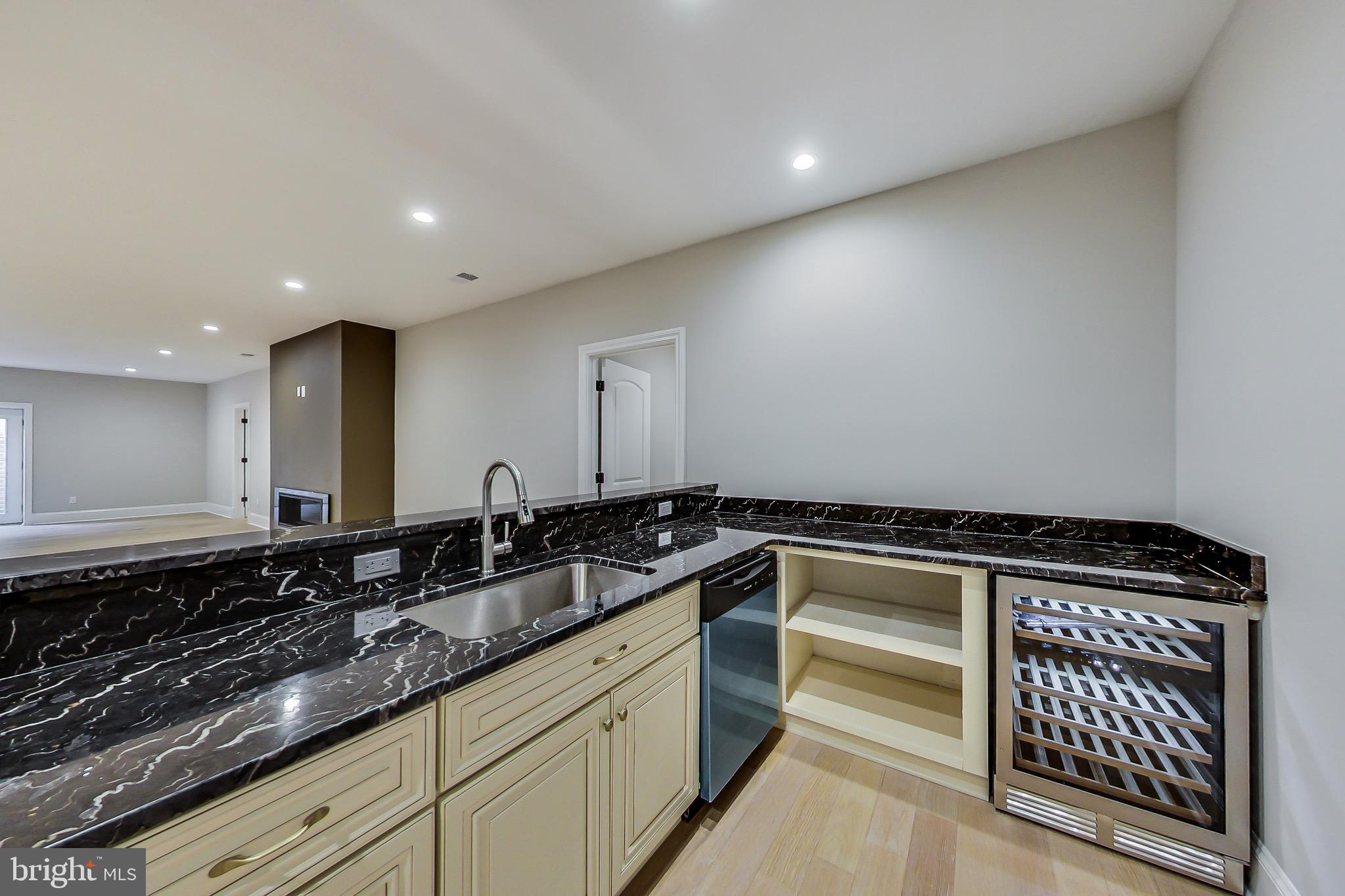 3104 Sleepy Hollow Road Falls Church, VA 22042 - Photo 48 of 89 a kitchen with granite countertop a sink and cabinets