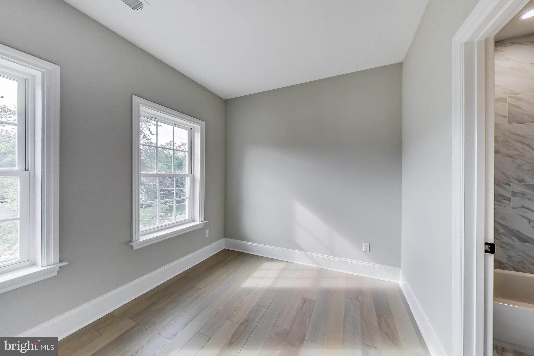 3104 Sleepy Hollow Road Falls Church, VA 22042 - Photo 55 of 89 an empty room with wooden floor and windows