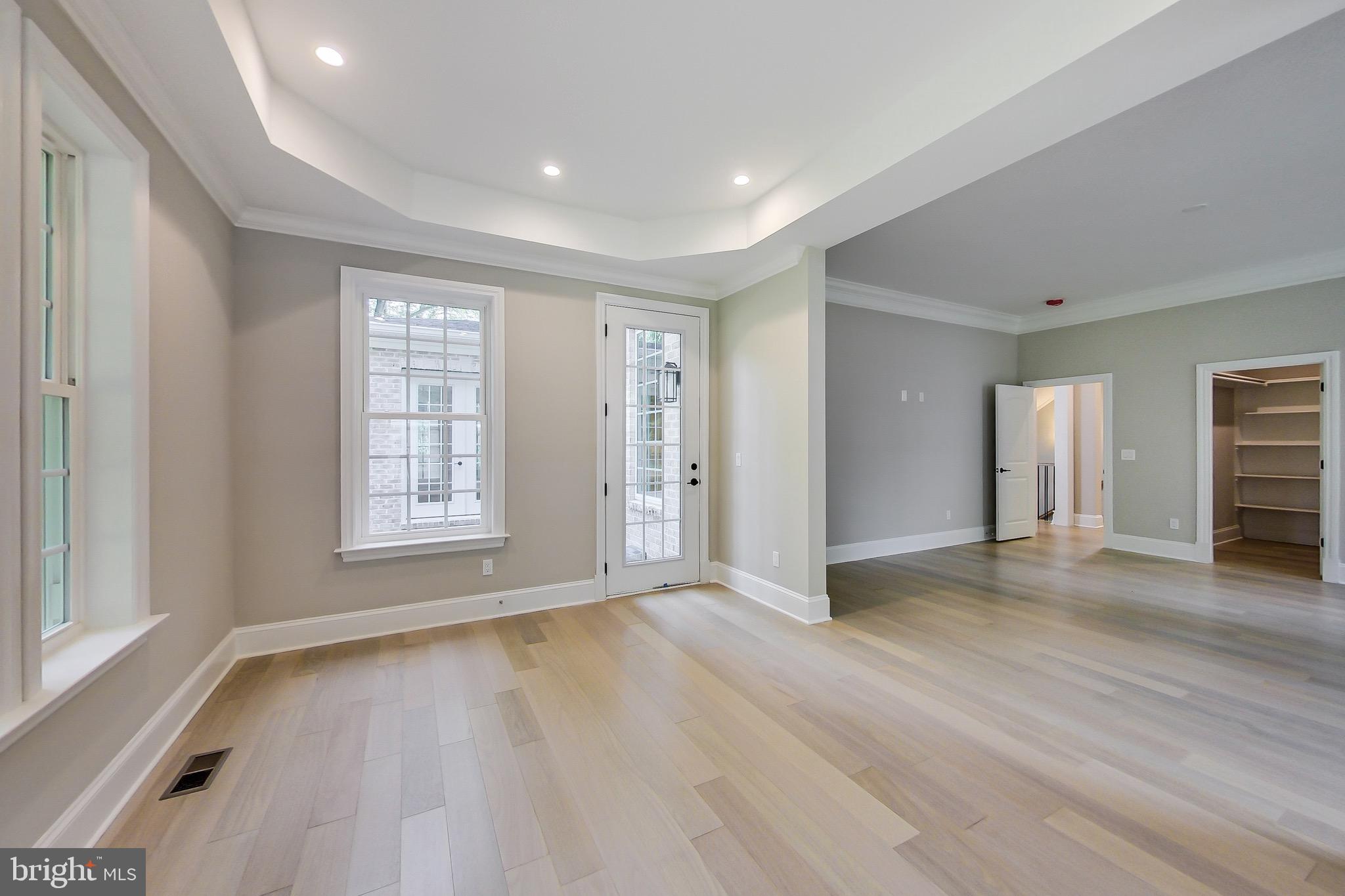3104 Sleepy Hollow Road Falls Church, VA 22042 - Photo 59 of 89 an empty room with wooden floor and windows