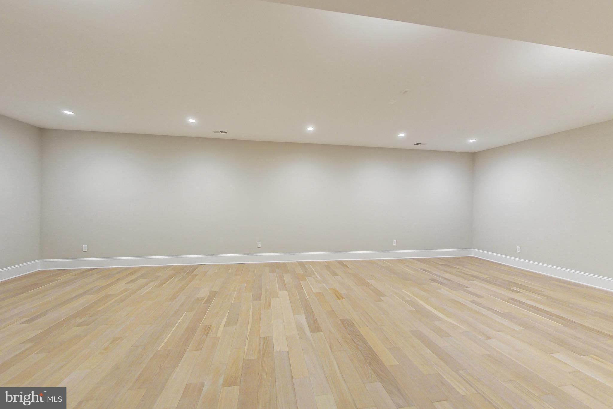 3104 Sleepy Hollow Road Falls Church, VA 22042 - Photo 81 of 89 an empty room with wooden floor and windows