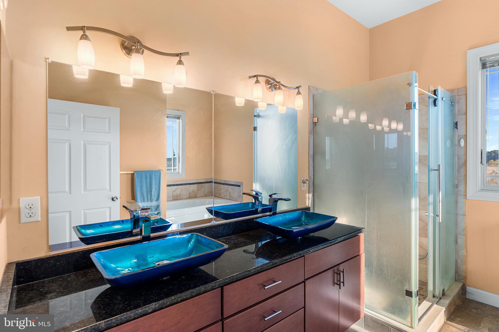 1252 Old Madison Road Madison, MD 21648 - Photo 22 of 55 a bathroom with a granite countertop sink and a mirror
