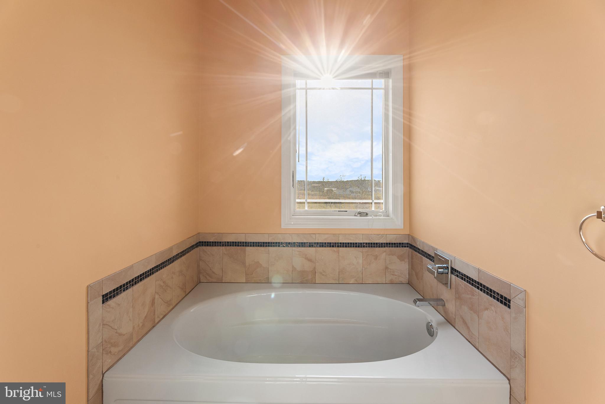 1252 Old Madison Road Madison, MD 21648 - Photo 24 of 55 a bathroom with a bathtub