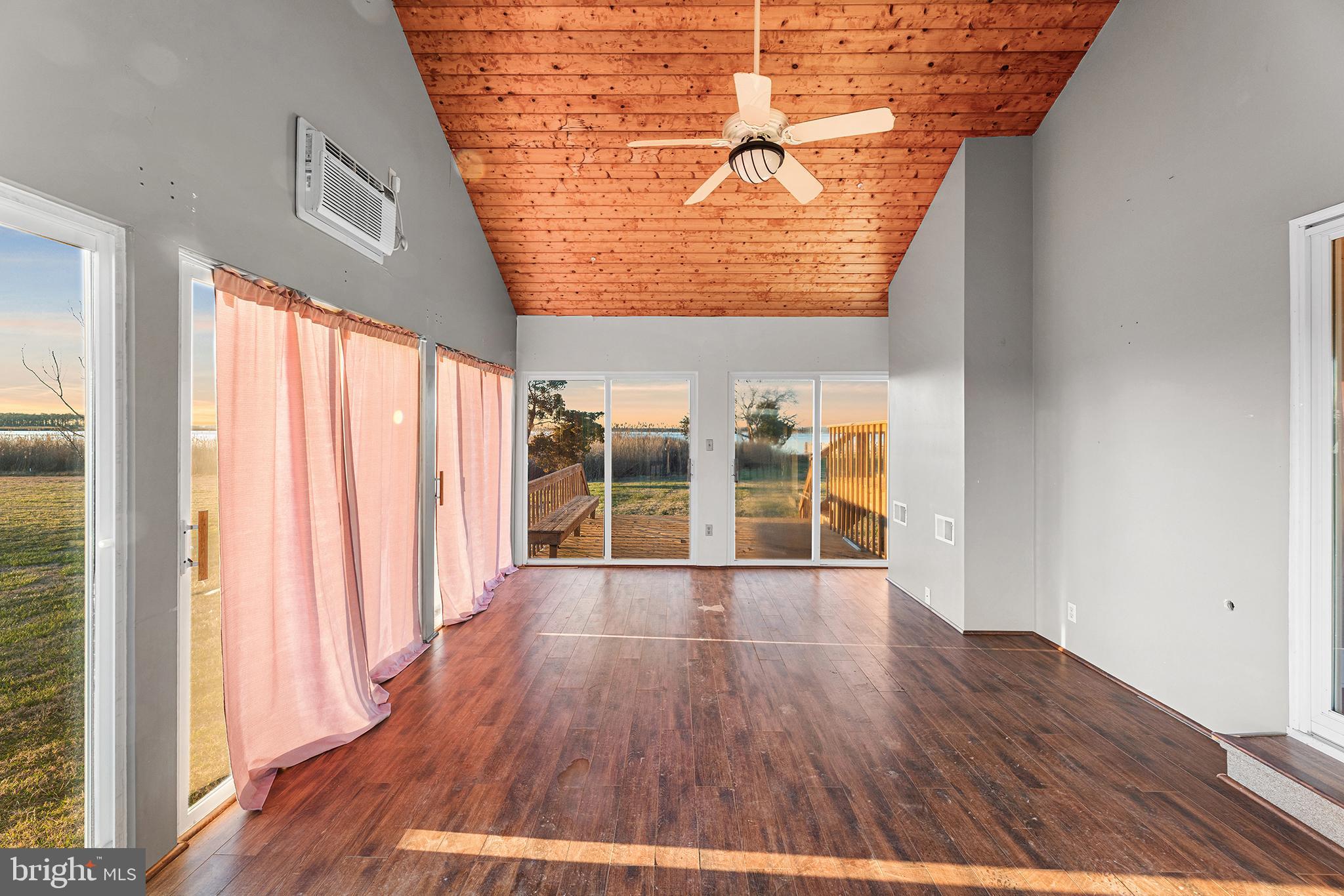 1252 Old Madison Road Madison, MD 21648 - Photo 51 of 55 wooden floor in an empty room with a window
