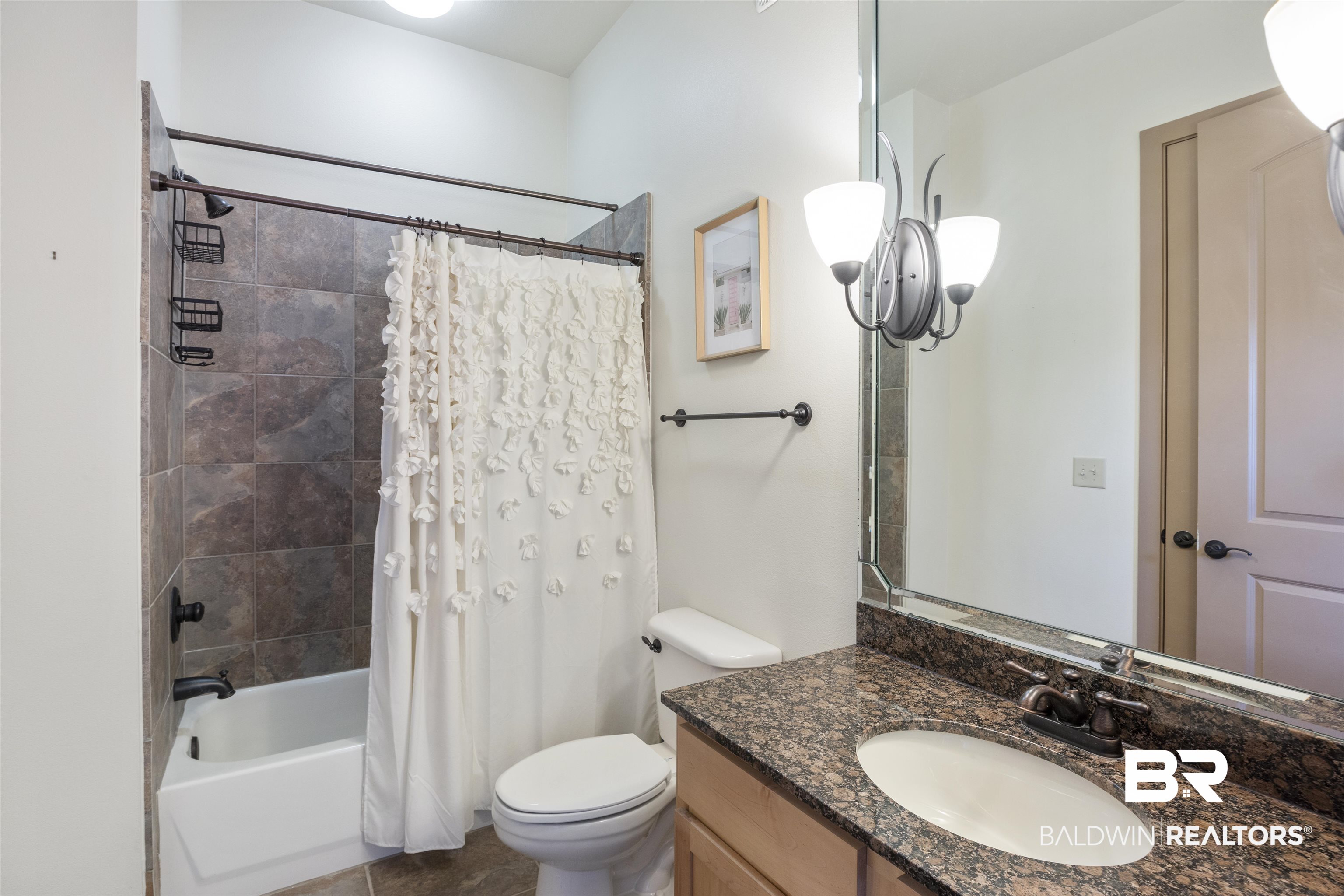 1430 Regency Road, Unit B201 Gulf Shores, AL 36542 - Photo 31 of 59 Full bathroom with shower / tub combo and vanity