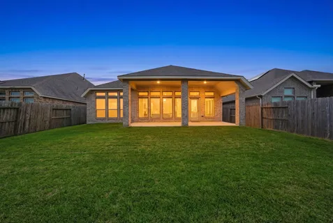 a front view of a house with yard
