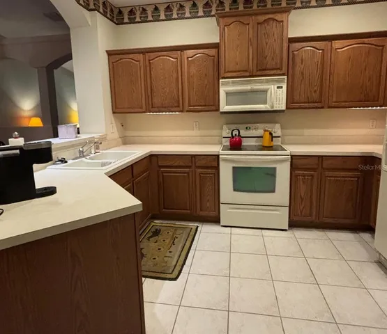 a kitchen with a cabinets and appliances