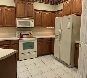a kitchen with stainless steel appliances a stove and a refrigerator