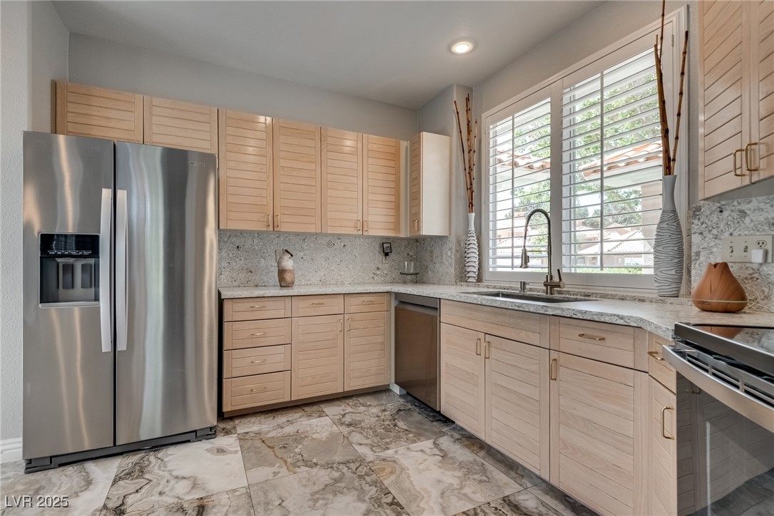 8541 Heather Downs Drive Las Vegas, NV 89113 - Photo 12 of 39 Kitchen with appliances with stainless steel finis