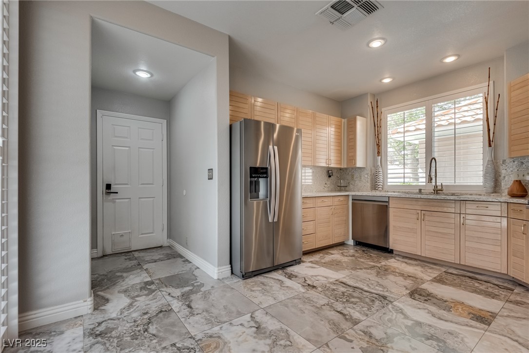 8541 Heather Downs Drive Las Vegas, NV 89113 - Photo 15 of 39 Kitchen with appliances with stainless steel finis