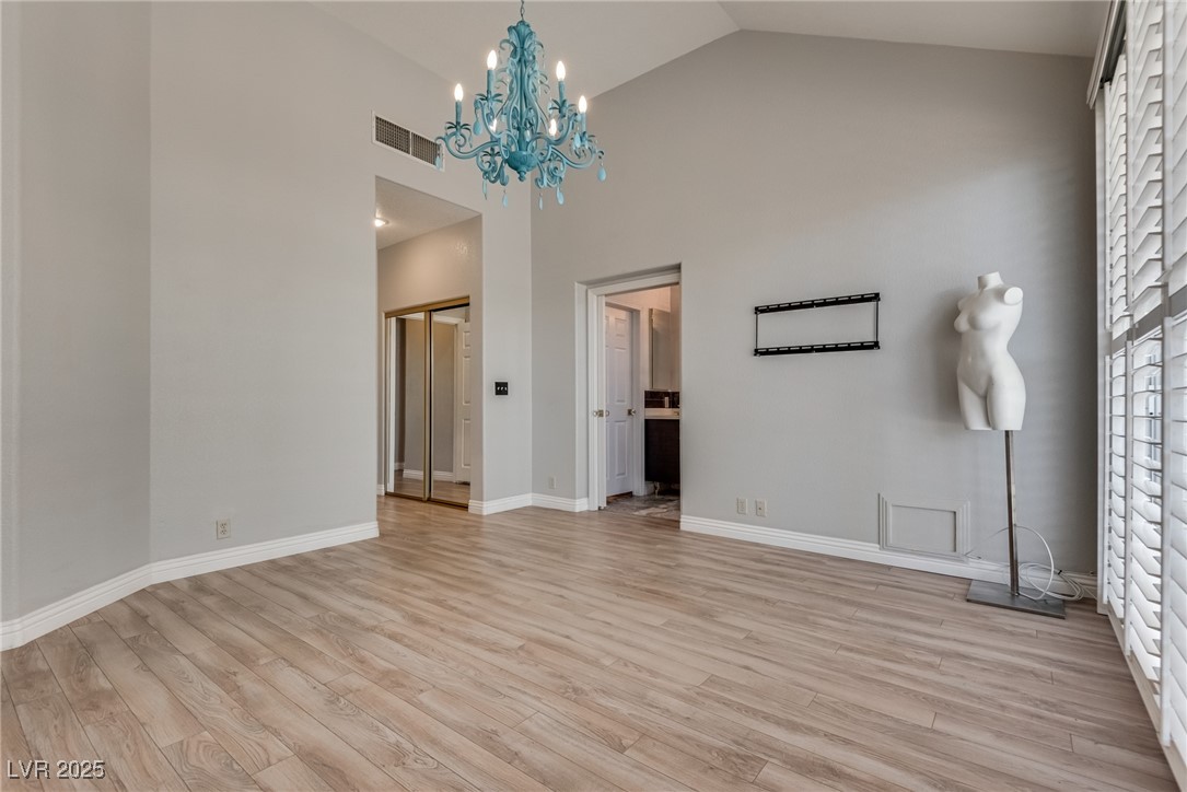 8541 Heather Downs Drive Las Vegas, NV 89113 - Photo 17 of 39 Unfurnished living room with light wood finished f