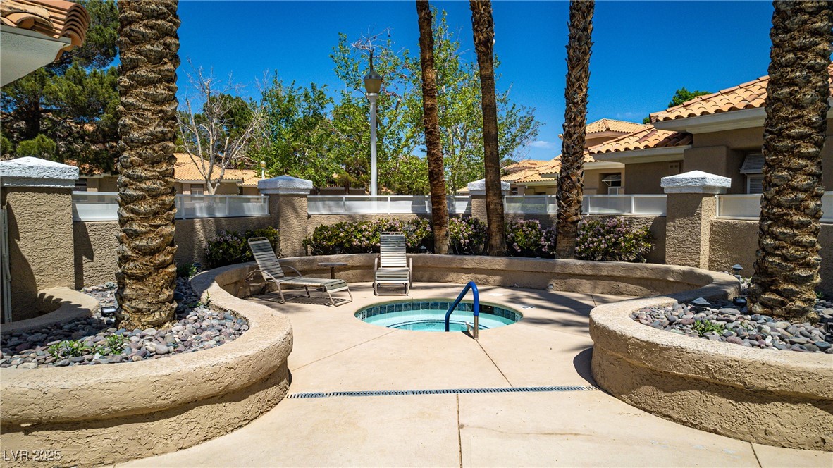 8541 Heather Downs Drive Las Vegas, NV 89113 - Photo 24 of 39 View of swimming pool featuring a community hot tu