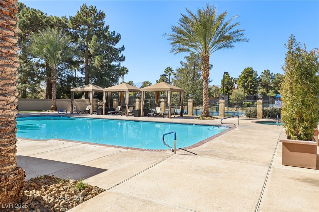 8541 Heather Downs Drive Las Vegas, NV 89113 - Photo 33 of 39 Community pool with a gazebo and a patio area