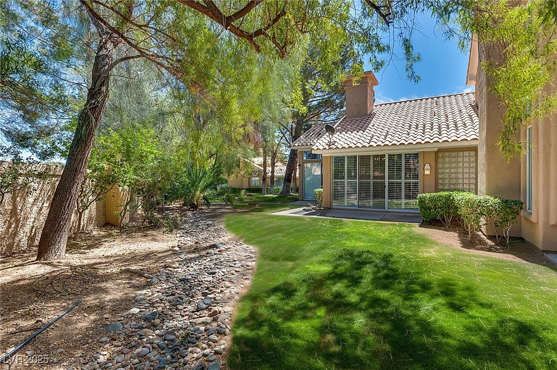 8541 Heather Downs Drive Las Vegas, NV 89113 - Photo 6 of 39 View of green lawn