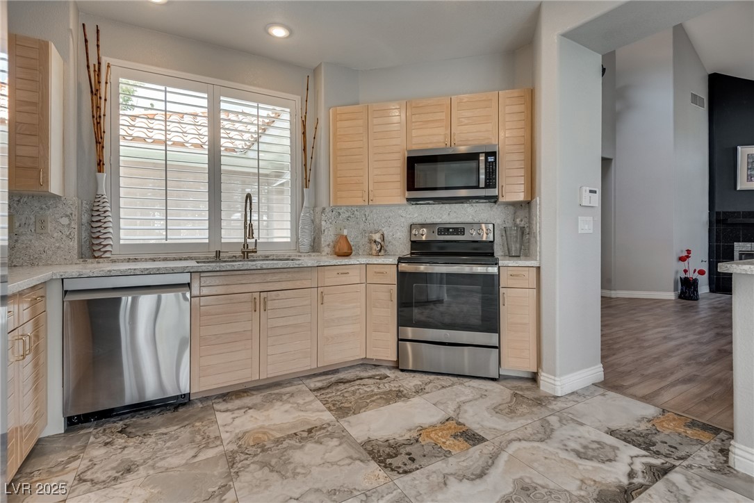 8541 Heather Downs Drive Las Vegas, NV 89113 - Photo 10 of 39 Kitchen featuring appliances with stainless steel