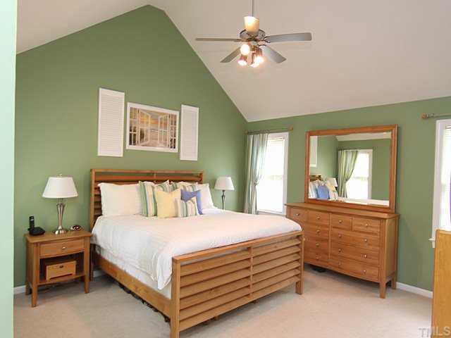 1109 Riderwood Court Willow Spring, NC 27592 - Photo 6 of 11 You can see how large this master suite is and note the lovely paint and new ceiling fan! Cathedral ceilings and 3 large windows add lots of light to this wonderful, warm room!