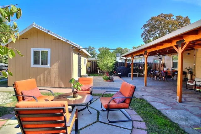 a view of outdoor space with sliding door and outdoor seating