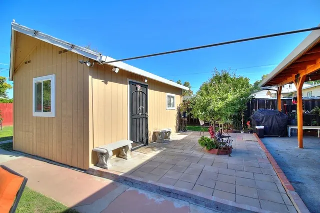 a bedroom with a bed and a mirror on dresser